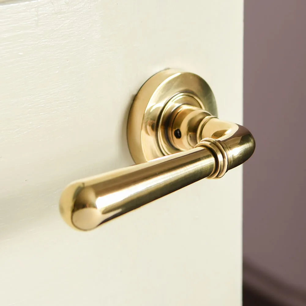 Polished Antique Brass Newbury Lever Door Handles on Concealed Rose